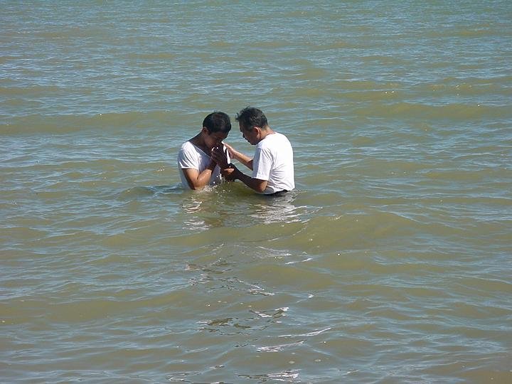 Elder Villamor baptizing Edward Ariel Tadea